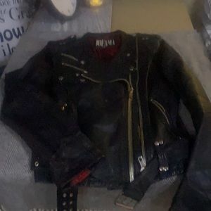 Women black leather jacket with accent zippers